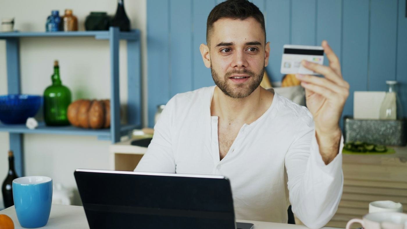 Shopping online with a card and a laptop